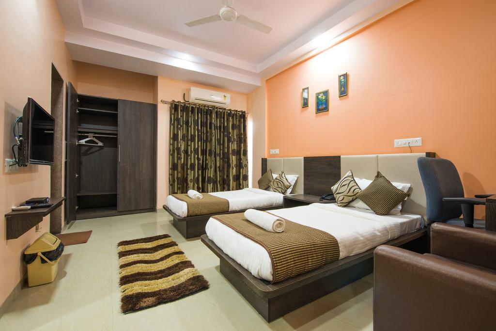 Budget Inn Service Apartments - Tiger Plaza Vengni Room photo