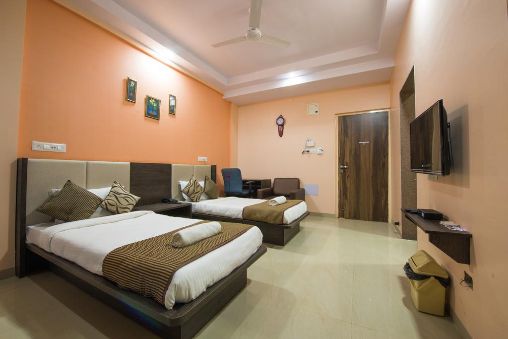 Budget Inn Service Apartments - Tiger Plaza Vengni Room photo